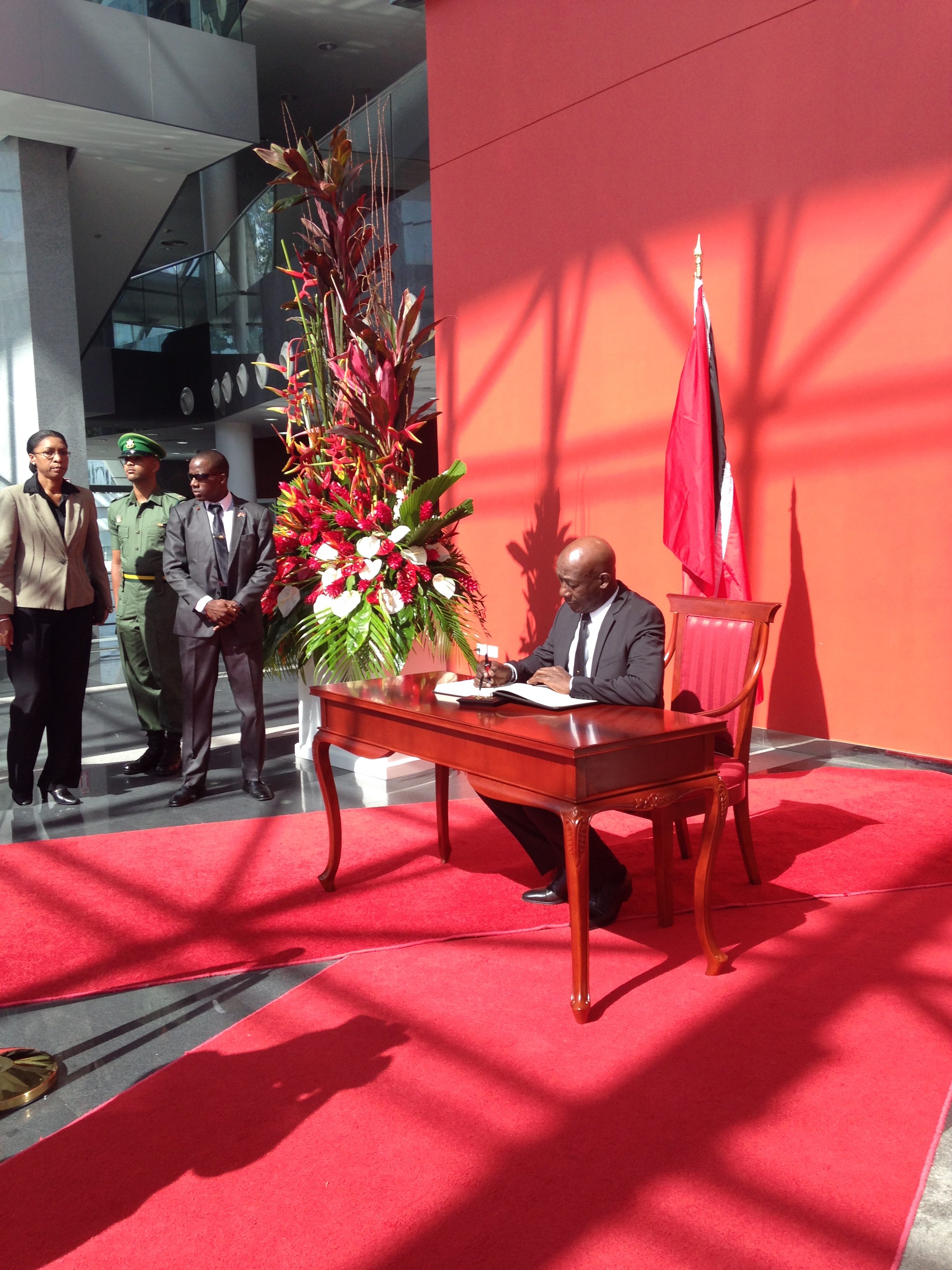 Dr. the Honourable Keith Rowley signs